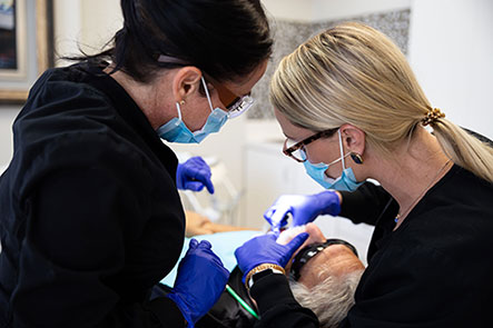 Doctor performing cosmetic dentistry service at Reich Dental Center – Roswell.