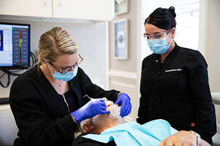 Doctor operates dental service at Reich Dental Center in Smyrna, GA.