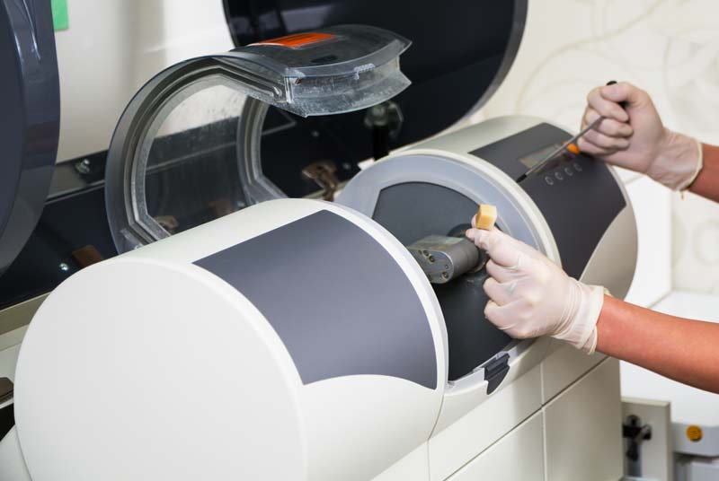 Image of hands preping CEREC® machine at Reich Dental Center – Roswell in Roswell, GA.